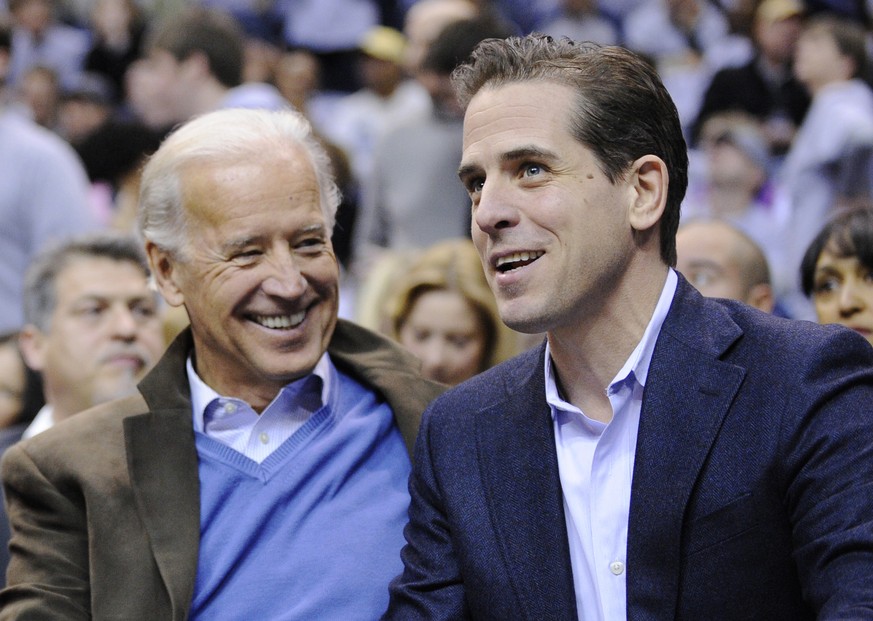 FILE - Then Vice President Joe Biden, left, and his son Hunter Biden appear at the Duke Georgetown NCAA college basketball game in Washington on Jan. 30, 2010. Hunter Biden, an ongoing target for cons ...