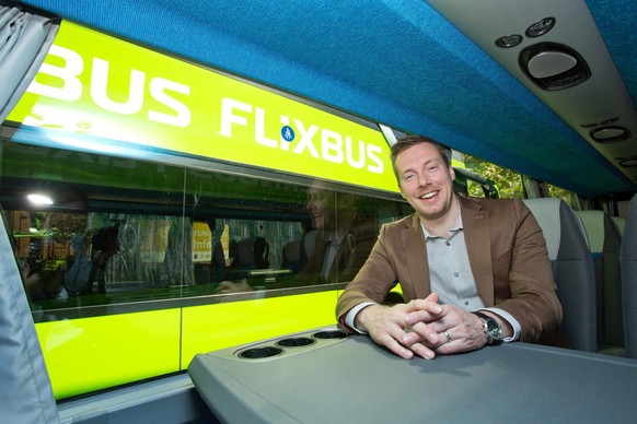 epa04779897 Andre Schwaemmlein, CEO of MeinFernbus Flixbus, sits in the company&#039;s new bus during a press conference in Berlin, Germany, 02 June 2015. After the merging of MeinFernbus and Flixbus  ...