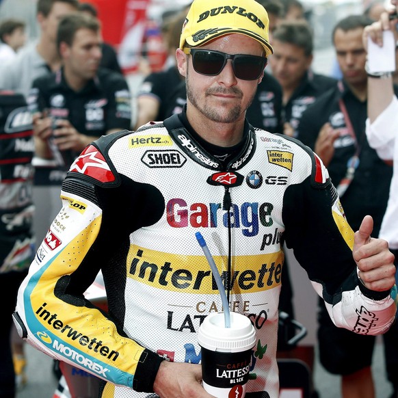 epa05345681 Swiss Moto2 rider Thomas Luthi of the Garage Plus Interwetten team celebrates his third position after the qualifying session of the Motorcycling Grand Prix of Catalunya at Catalunya circu ...