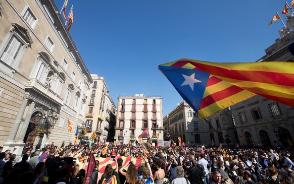 epa06290750 A Catalan pro-independence flag waves over hundreds of Catalan university and secondary students protesting against the application of the Spanish Constitution&#039;s Article 155 to the Ca ...