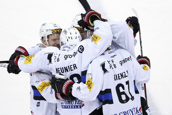 Fribourg&#039;s forward Laurent Meunier #79, of France, celebrates his goal with teammates after scoring the 0:2, during a National League regular season game of the Swiss Championship between Geneve- ...