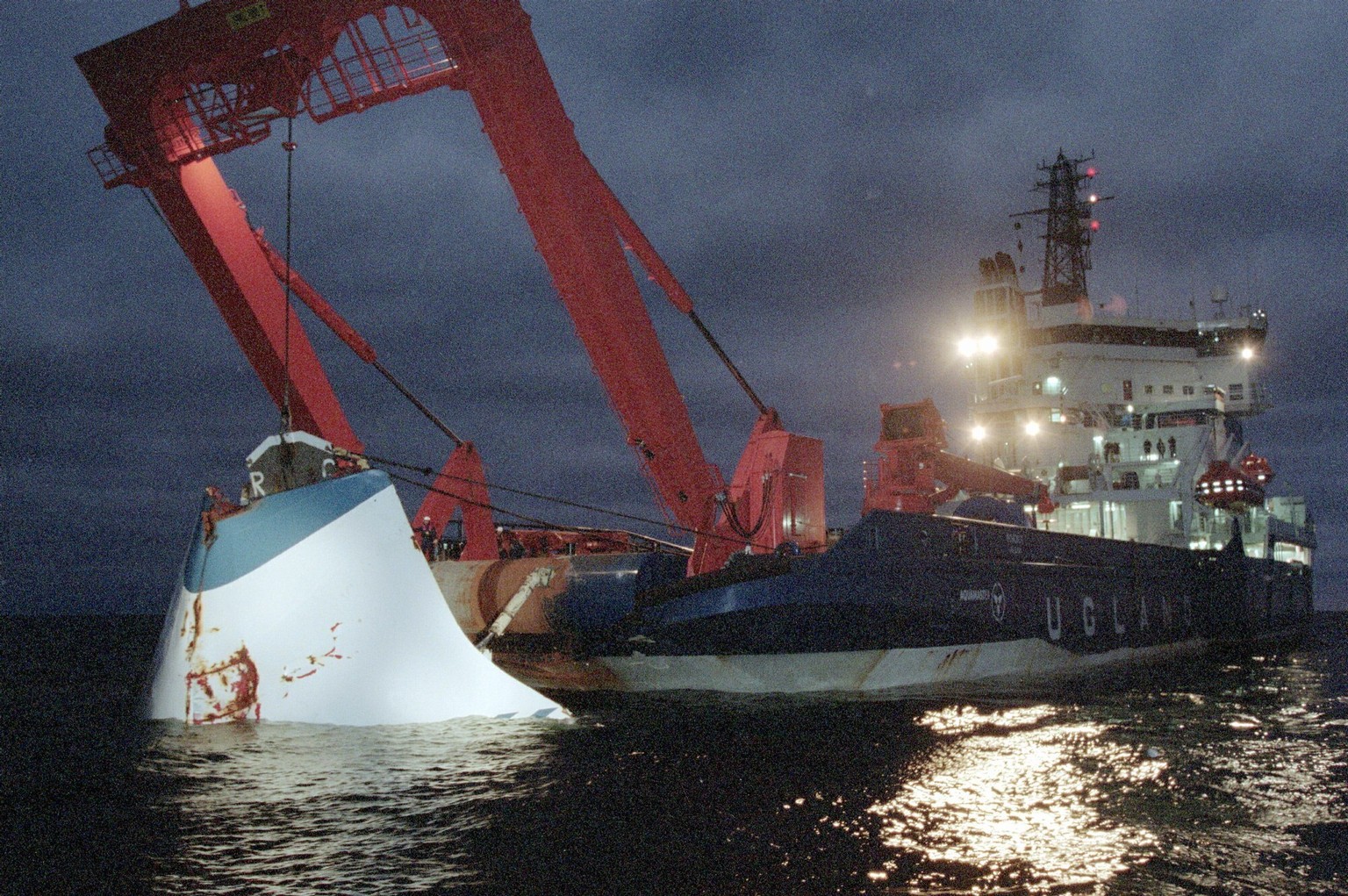 FILE - In this Nov. 19, 1994 file photo, the bow door of the sunken passenger ferry M/S Estonia is lifted up from the bottom of the sea, off Uto Island, in the Baltic Sea. The governments of Sweden, F ...