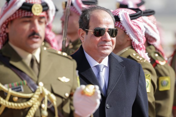 epa07279571 Egyptian President Abdel Fattah al-Sisi reviews the Jordan Royal Guard of Honor with Jordan King Abdullah II (not pictured), upon his arrival at Marka Airport, Amman, Jordan, 13 January 20 ...