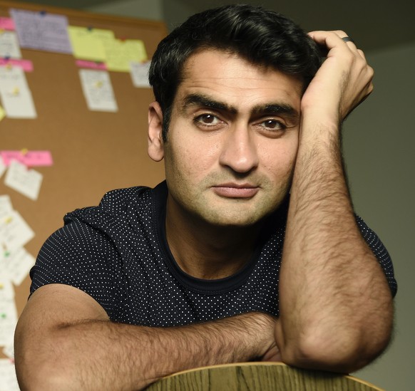 In this Nov. 21, 2017 photo, actor-comedian Kumail Nanjiani, co-writer and star of the film &quot;The Big Sick,&quot; poses for a portrait in front of a billboard of script notecards at his home in Lo ...