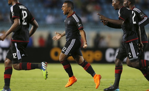 Kermit Erasmus (2nd L) of South Africa&#039;s Orlando Pirates celebrates after scoring against Egypt&#039;s Al Ahly during their African Confederation Cup semi-final soccer match at the Suez Stadium i ...