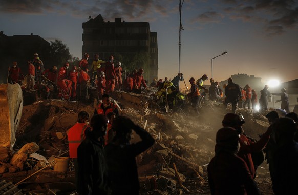 Members of rescue services search for survivors in the debris of a collapsed building in Izmir, Turkey, Monday, Nov. 2, 2020. In scenes that captured Turkey&#039;s emotional roller-coaster after a dea ...
