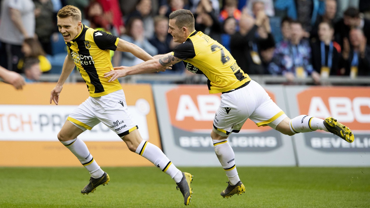 epa07490635 Martin Odegaard (L) of Vitesse celebrates with teammate Thomas Buitink scoring during the Dutch Eredivisie soccer match between Vitesse and PSV Eindhoven in Arnhem, the Netherlands, 07 Apr ...