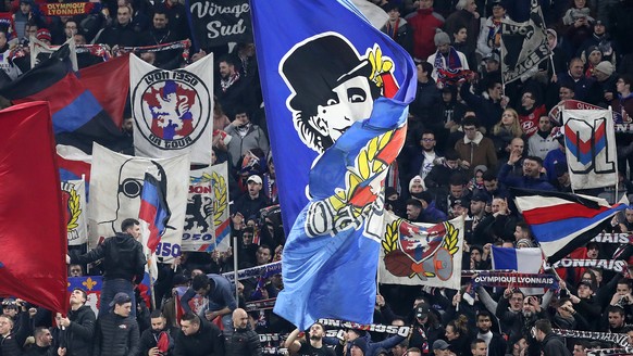 epa06606833 Supporters of Olympique Lyon cheer for their team during the UEFA Europa League round of 16 second leg soccer match between Olympique Lyon and CSKA Moscow, at Parc Olympique Lyonnais stadi ...