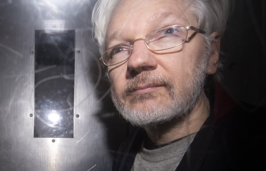 epa08125147 Wikileaks founder Julian Assange leaves Westminster Magistrates Court in London, Britain, 13 January 2020. Assange appeared in court to prevent his extradition to the US where would be fac ...