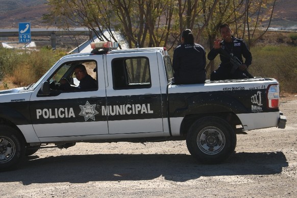 M wie Maschinengewehr: Polizisten mit Maschinengewehr auf einem Pick-up: In Mexiko das Normalste der Welt.