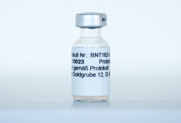 epa08830897 An undated handout made available by the German pharmaceutical company Biontech shows an ampoule with BNT162b2, the mRNA-based vaccine candidate against COVID-19, in Mainz, Germany (reissu ...