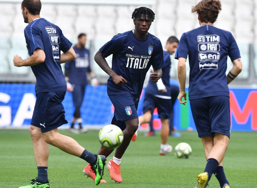 Italy&#039;s Moise Kean, center, looks at the ball during a training session ahead of Tuesday&#039;s Euro 2020 group J qualifying soccer match against Bosnia Herzegovina, at the Allianz Stadium in Tur ...