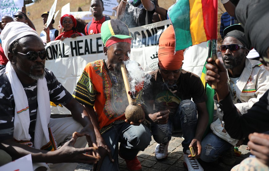 epa07029337 Supporters of the legislation of marijuana celebrate after the Constitutional Court ruled that the personal use and growing of marijuana in South Africa is legal, Johannesburg, South Afric ...