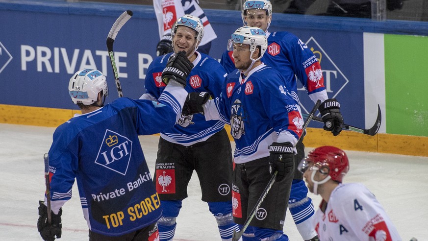 The players fron Zug with Johann Morant and Jan Kovar, centre, reacts after a goal during the Champions Hockey League group B match between Switzerland&#039;s EV Zug and Rungsted Seier Capital of Danm ...