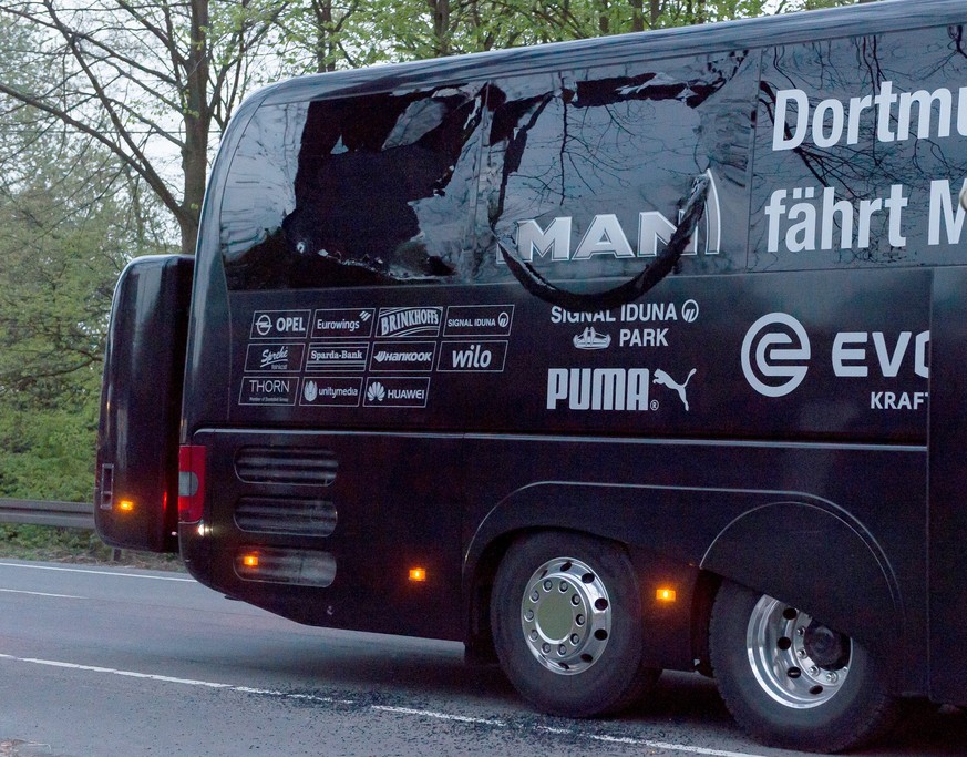 epa05903396 A view on the damaged Borussia Dortmund&#039;s team bus after it was hit by three explosions in Dortmund, Germany, 11 April 2017. According to reports, Borussia Dortmund&#039;s team bus wa ...