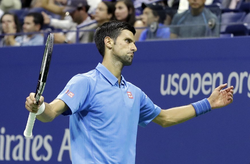 Novak Djokovic, of Serbia, reacts after missing a shot against Jerzy Janowicz, of Poland, during the first round of the US Open tennis tournament, Monday, Aug. 29, 2016, in New York. (AP Photo/Darron  ...