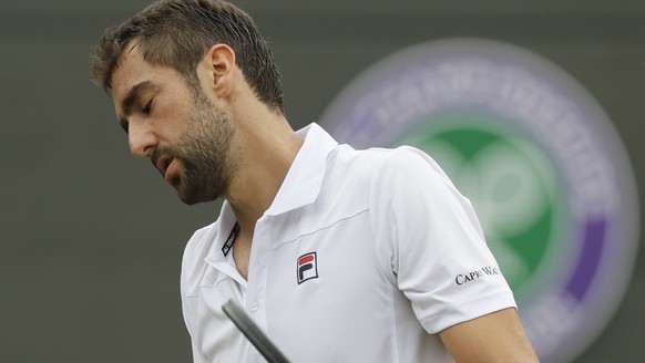 Marin Cilic of Croatia loses a point to Guido Pella of Argentina during their men&#039;s singles match on the fourth day at the Wimbledon Tennis Championships in London, Thursday July 5, 2018. (AP Pho ...