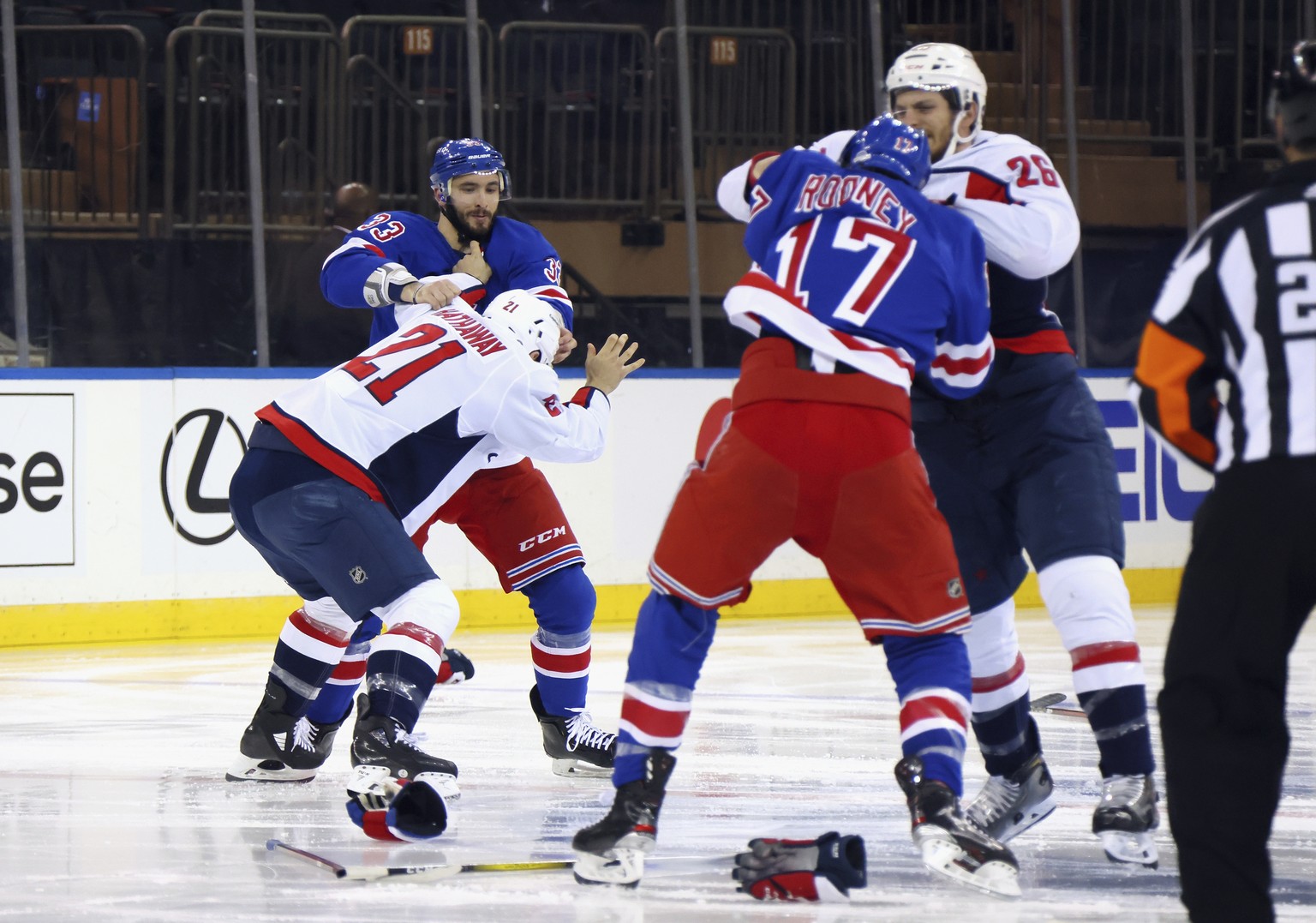 Washington Capitals and New York Rangers fight in the opening seconds of an NHL hockey game Wednesday, May 5, 2021, in New York. (Bruce Bennett/Pool Photo via AP)