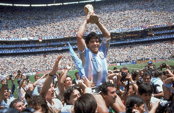 FILE - In this June 29, 1986, file photo, Diego Maradona, holds up the trophy, after Argentina beat West Germany 3-2 in their World Cup soccer final match, at the Atzeca Stadium, in Mexico City. On th ...