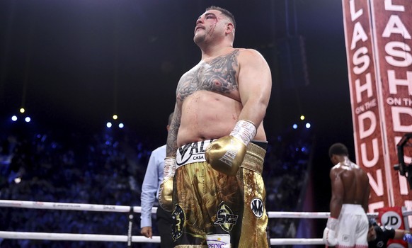 Defending champion Andy Ruiz Jr., left, walks back to his corner at the end of a round after getting cut during his fight against Britain&#039;s Anthony Joshua in their World Heavyweight Championship  ...