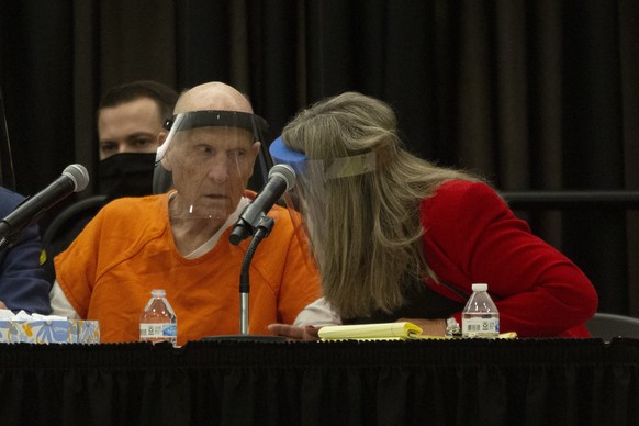 Joseph James DeAngelo, charged with being the Golden State Killer, huddles with his attorney, public defender Diane Howard, during a hearing in Sacramento, Calif., Monday June 29, 2020. DeAngelo, 74,  ...