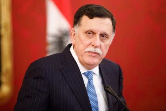 epa07327772 Prime Minister of Libya Fayez al-Sarraj speaks during a press conference after his meeting with Austrian Federal President Alexander Van der Bellen (unseen) at the presidential office of t ...