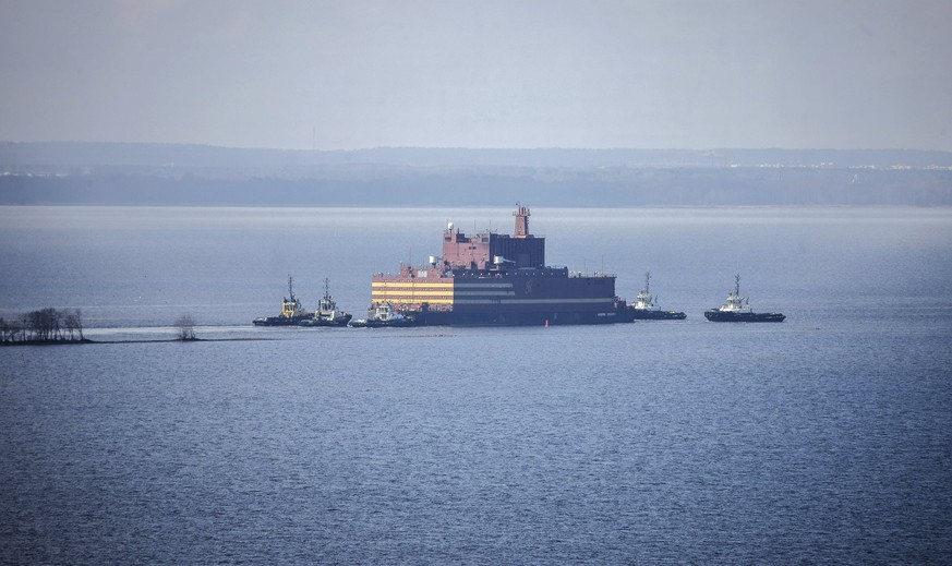 epa06702173 An undated handout photo made available by Greenpeace shows the &#039;Akademik Lomonosov&#039;, the world&#039;s first floating nuclear power plant, under tow and leaving St. Petersburg, R ...