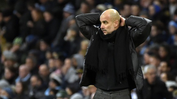 Manchester City&#039;s head coach Pep Guardiola reacts during the English Premier League soccer match between Manchester City and Manchester United at Etihad stadium in Manchester, England, Saturday,  ...