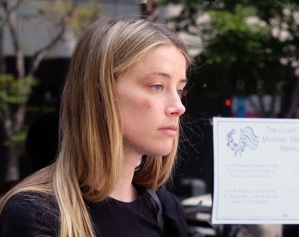 Actress Amber Heard leaves Los Angeles Superior Court court on Friday, May 27, 2016, after giving a sworn declaration that her husband Johnny Depp threw her cellphone at her during a fight Saturday, s ...