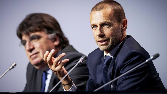 epa08266420 UEFA general secretary Theodore Theodoridis (L) and UEFA president Aleksander Ceferin (R) attend a press conference following the annual UEFA Congress meeting at the Beurs van Berlage buil ...