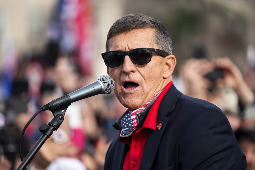 epa08879709 Former National Security Advisor and convicted felon Michael Flynn speaks to supporters of US President Donald J. Trump who gathered outside the Supreme Court to echo Trump&#039;s baseless ...