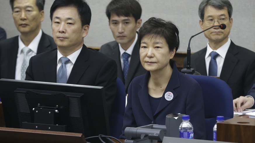 epa06648911 (FILE) - Former South Korean President Park Geun-hye (R, front) sits for her trial at the Seoul Central District Court in Seoul, South Korea, 23 May 2017 (reissued 06 April 2018). South Ko ...