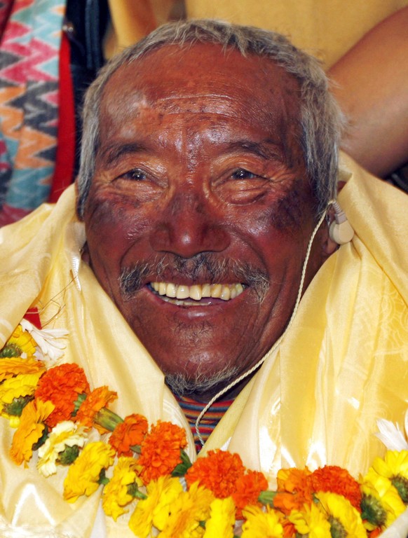 FILE - In this May 31, 2008 file photo, Min Bahadur Sherchan, who became the oldest person to climb Mount Everest on May 25, 2008, smiles upon his arrival in Katmandu, Nepal. Officials say Sherchan wh ...