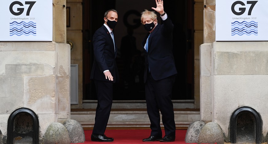 epa09179170 British Foreign Secretary Dominic Raab (L) with British Prime Minister Boris Johnson (R) at the G7 Foreign Ministers meeting at Lancaster House in London, Britain, 05 May 2021. Foreign Min ...