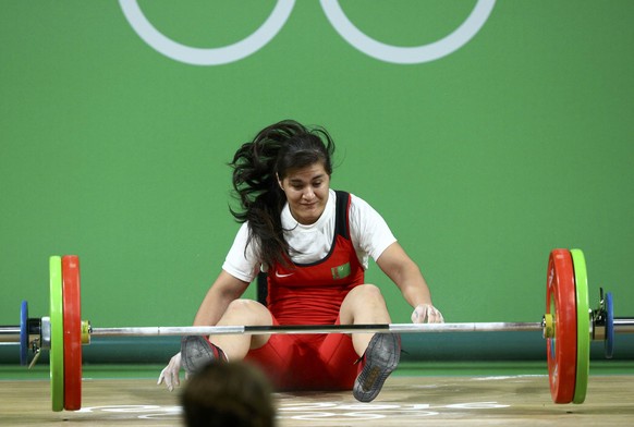 2016 Rio Olympics - Weightlifting - Final - Women&#039;s 69kg - Riocentro - Pavilion 2 - Rio de Janeiro, Brazil - 10/08/2016. Gulnabat Kadyrova (TKM) of Turkmenistan falls as she fails a lift. REUTERS ...