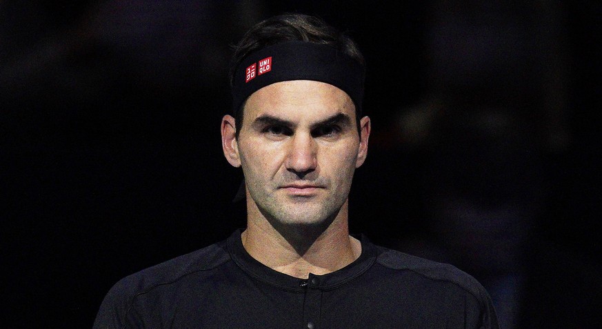 epa07987040 Roger Federer of Switzerland reacts during his round robin match against Dominic Thiem of Austria at the ATP World Tour Finals tennis tournament in London, Britain, 10 November 2019. EPA/W ...