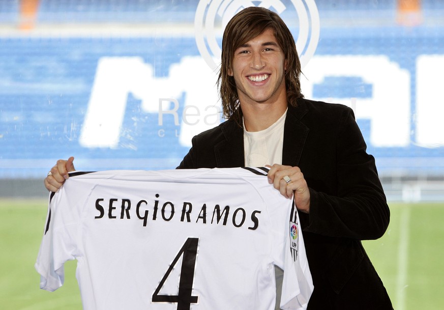 Real Madrid&#039;s new defender Sergio Ramos shows his shirt during the official presentation for the Spanish soccer club, Madrid, Thursday Sept. 8, 2005. Ramos, who has signed an eight-year contract, ...