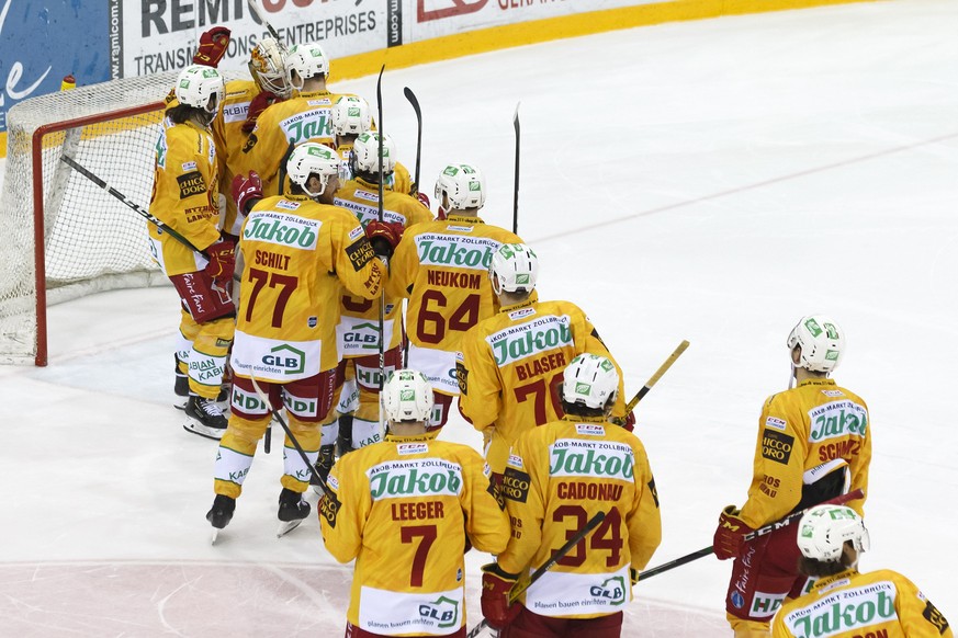 Tigers&#039; goaltender Ivars Punnenovs, of Latvia, is celebrated by his teammates after the shootout session, at the National League regular season game of the Swiss Championship between Geneve-Serve ...
