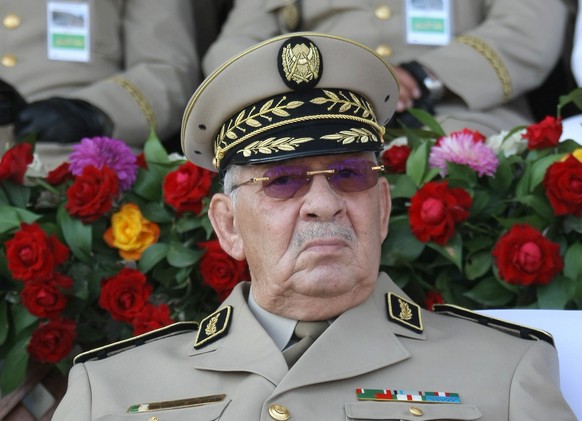 FILE - In this Sunday, July 1, 2018 file picture Algerian chief of staff Gen. Ahmed Gaid Salah presides a military parade in Algiers. Algeria&#039;s powerful army chief, Gen. Ahmed Gaid Salah, wants t ...