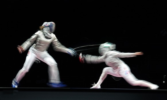epa09382562 Sara Balzer of France (L) in action with Sofia Pozdniakova of Russian Olympic Commitee (R) during the Fencing Women&#039;s Sabre Team Gold Medal Match of the Tokyo 2020 Olympic Games at th ...