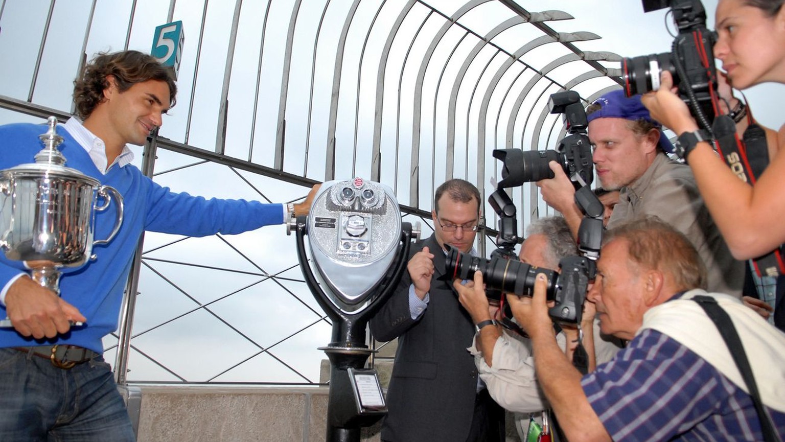 Swiss tennis player Roger Federer appears with his U.S. Open trophy during a photo op on the observation deck of the Empire State Building, Tuesday, Sept. 9, 2008 in New York. Federer won his fifth U. ...