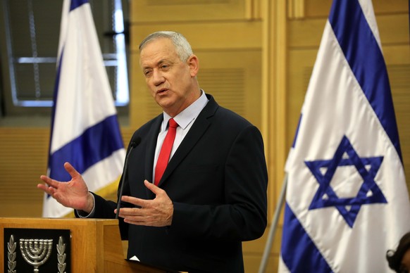 epa08057280 Leader of the Blue and White Party Benny Gantz speaks during faction meeting of the Blue and White party at the Israeli Knesset (parliament) in Jerusalem, Israel, 09 December 2019. Media r ...