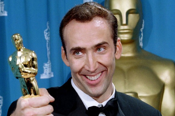 Actor Nicolas Cage gives holds his Oscar statuette after winning an Academy Award as best actor for his role in &quot;Leaving Las Vegas&quot; at the 68th Academy Awards telecast in Los Angeles, March  ...