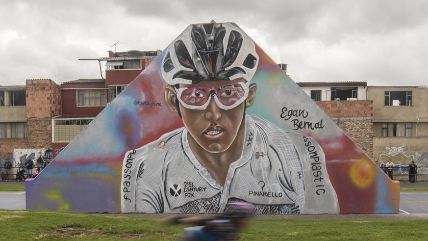 Children skate past a mural of Colombia&#039;s Egan Bernal in his hometown in Zipaquira, Colombia, Saturday, July 27, 2019. Barring a crash or a last-minute health issue, Bernal put on the overall lea ...