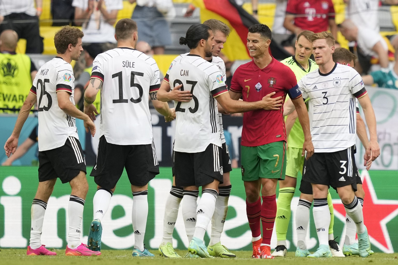 epa09286753 Cristiano Ronaldo (2R) of Portugal greets German players after the UEFA EURO 2020 group F preliminary round soccer match between Portugal and Germany in Munich, Germany, 19 June 2021. EPA/ ...