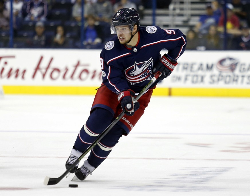 FILE - In this Tuesday, Sept. 19, 2017, file photo, Columbus Blue Jackets forward Artemi Panarin, of Russia, skates with the puck during a preseason NHL hockey game against the Chicago Blackhawks in C ...