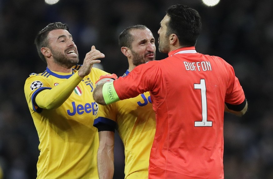 From left, Juventus&#039; Andrea Barzagli, Giorgio Chiellini and Gianluigi Buffon celebrate their side&#039;s 2-1 win, at the end of the the Champions League, round of 16, second-leg soccer match betw ...