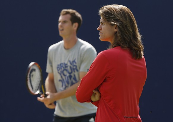 ADVANCE FOR WEEKEND EDITIONS, JUNE 21-22 - FILE - In this June 12, 2014, file photo, Andy Murray&#039;s new coach Amelie Mauresmo, right, watches him practice during a training session before his Quee ...