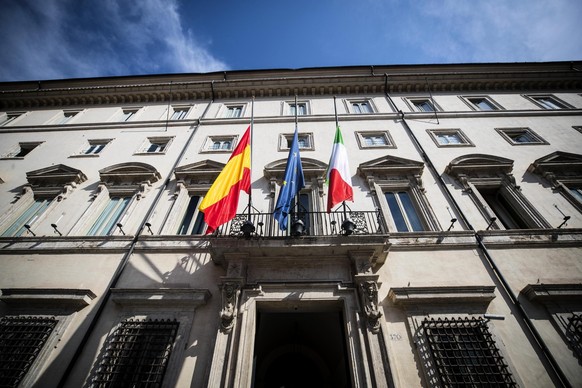 From left, flags of Spain, the European Union, and Italy fly at half-mast at Palazzo Chigi Premier&#039;s office, in Rome, Friday, Aug. 18, 2017 following Thursday&#039;s deadly van attack in Barcelon ...