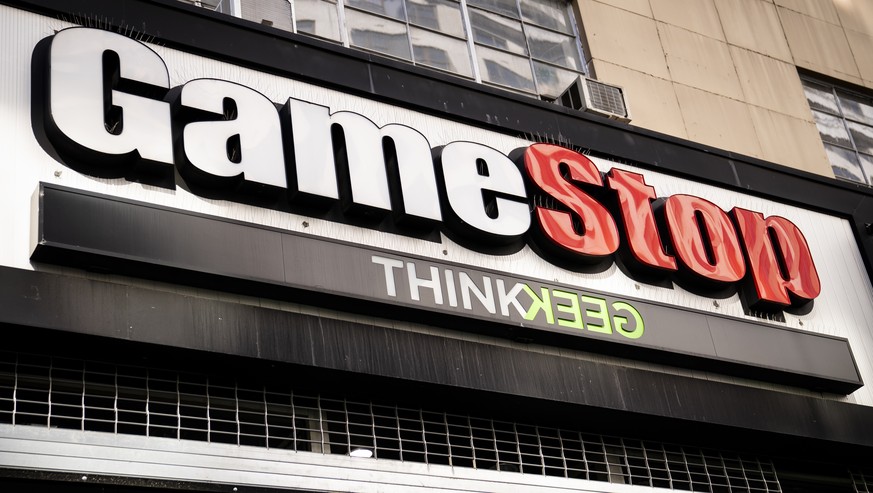 Pedestrians pass a GameStop store on 14th Street at Union Square, Thursday, Jan. 28, 2021, in the Manhattan borough of New York. Robinhood and other online trading platforms are moving to restrict tra ...